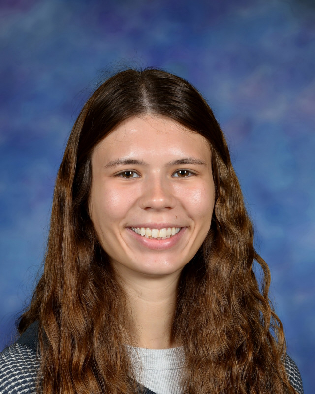 a man wearing a hat and glasses