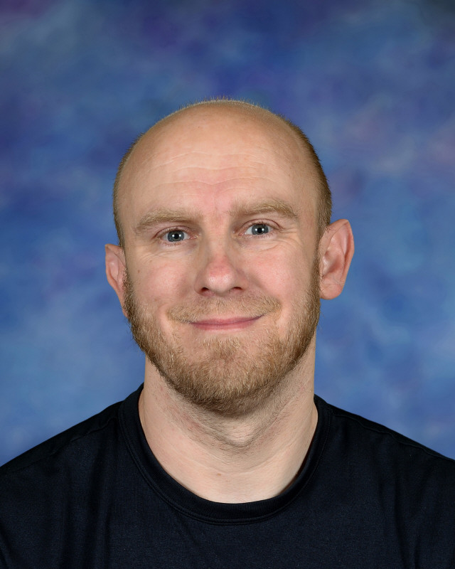 a man wearing a hat and glasses