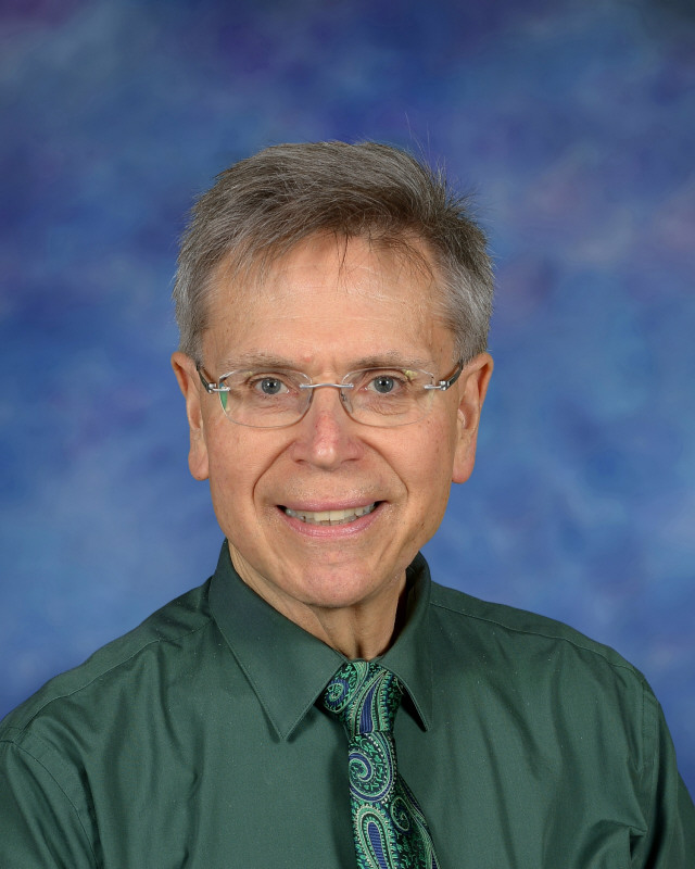 a man wearing a hat and glasses