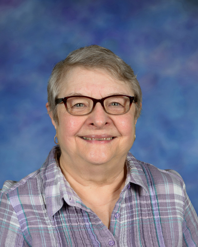 a man wearing a hat and glasses