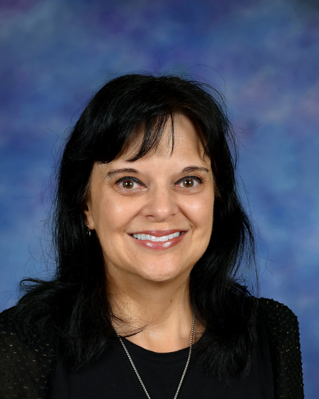 a man wearing a hat and glasses