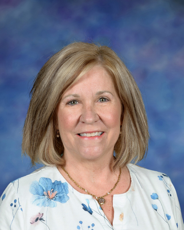 a man wearing a hat and glasses