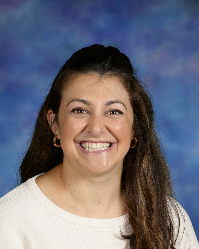 a man wearing a hat and glasses