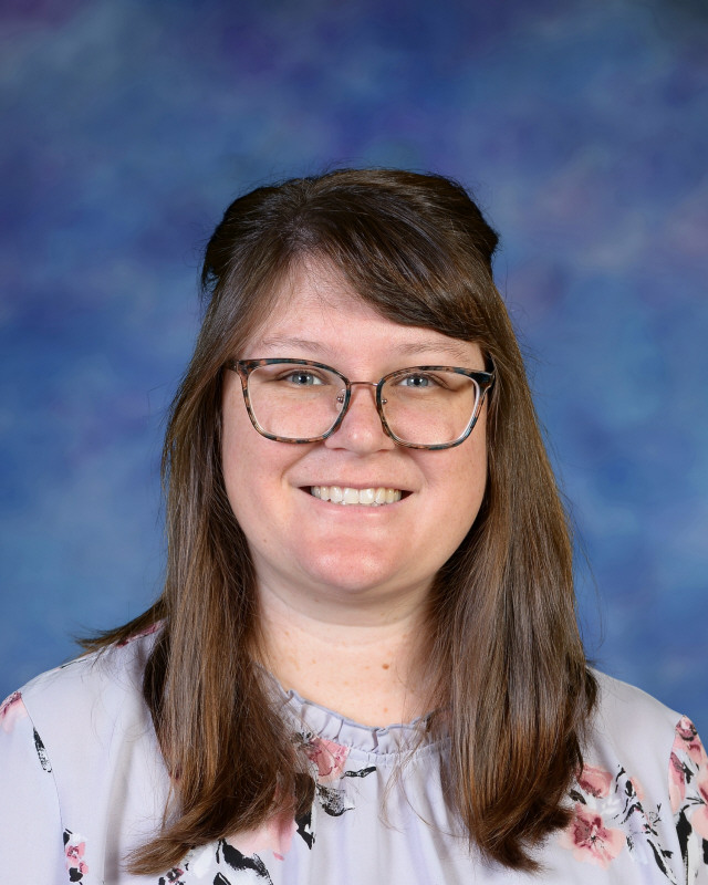 a man wearing a hat and glasses