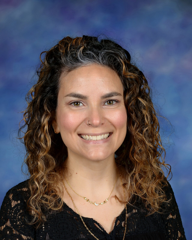 a man wearing a hat and glasses