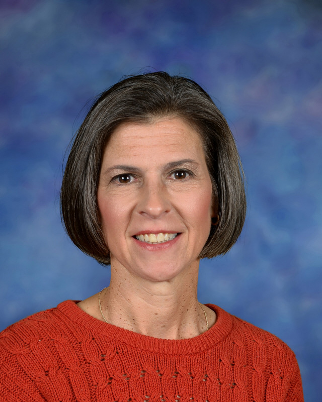 a man wearing a hat and glasses