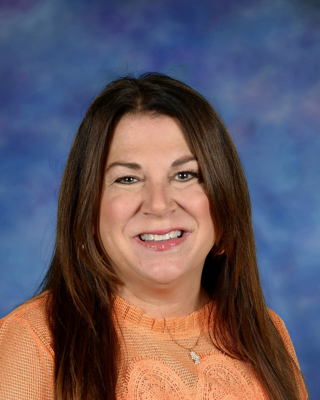 a man wearing a hat and glasses