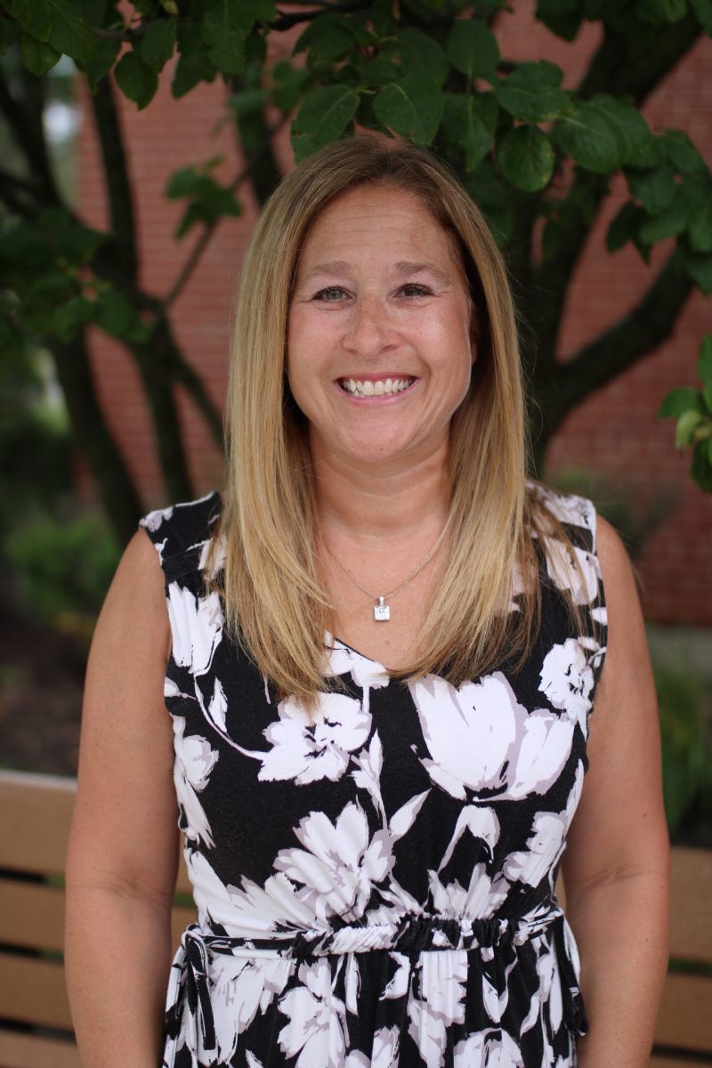three men and laughing two women walking side by side