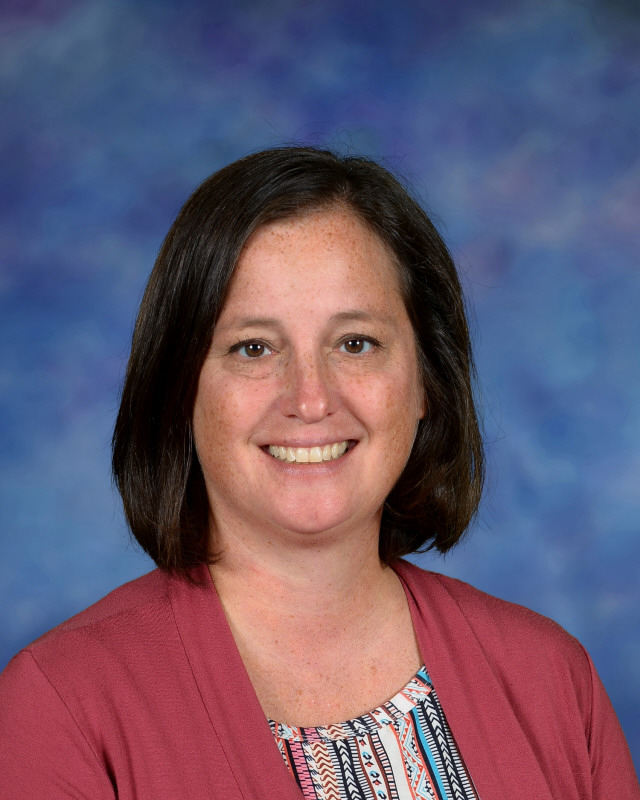 a man wearing a hat and glasses