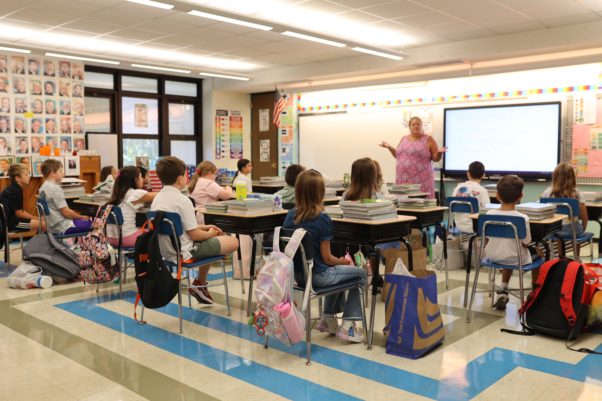three men and laughing two women walking side by side