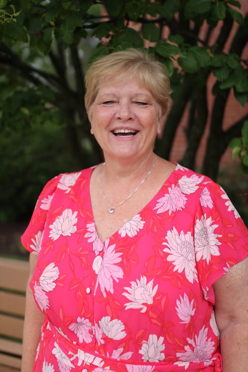 three men and laughing two women walking side by side