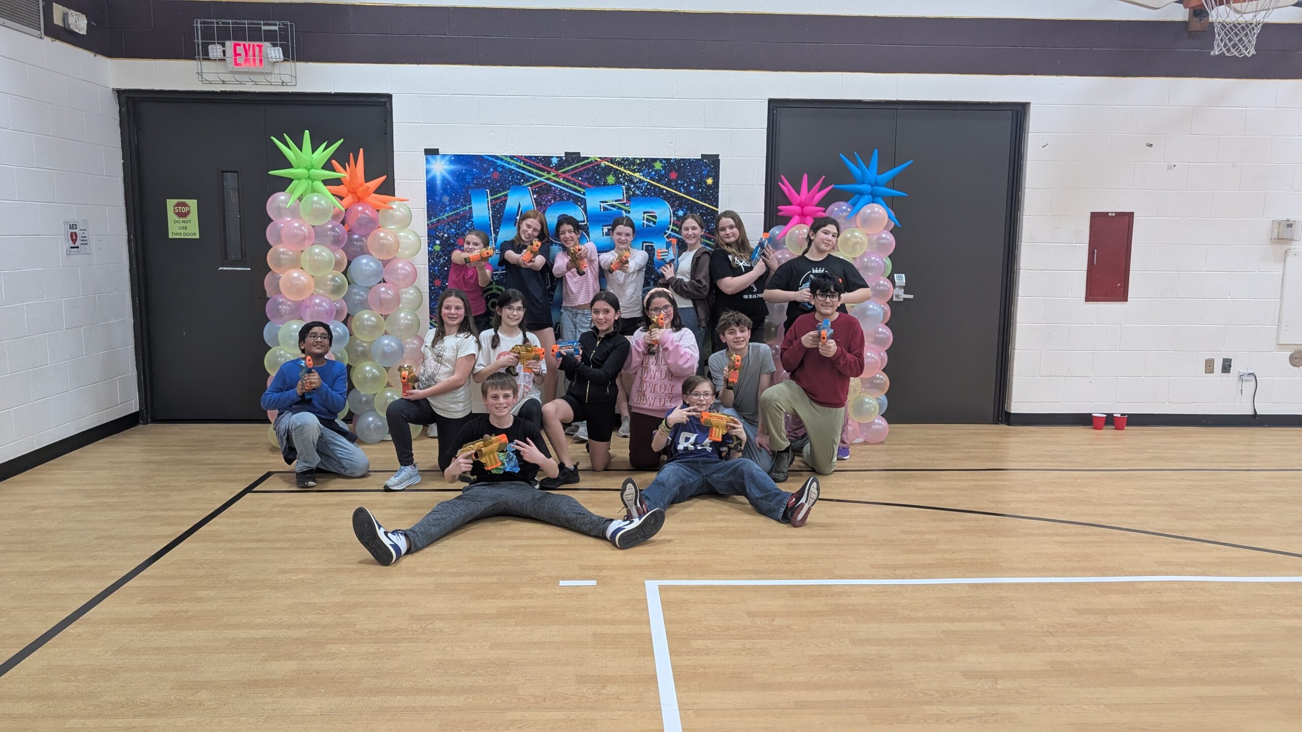 three men and laughing two women walking side by side