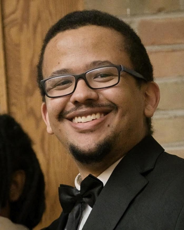 a man wearing a hat and glasses