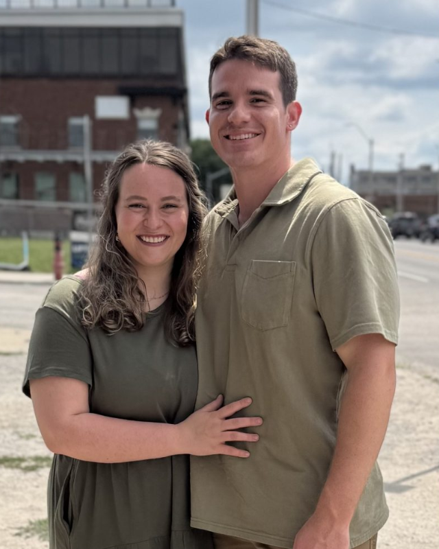 a man standing on top of a pile of snow